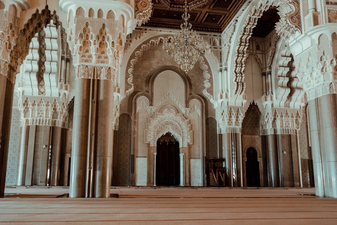 a large ornate building with pillars in morocco 